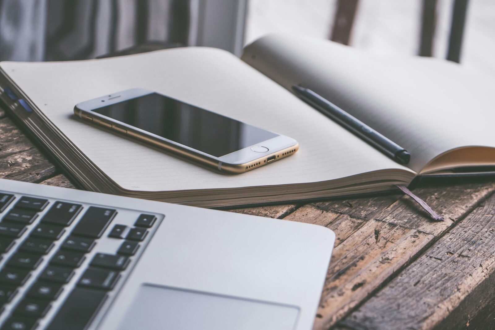 desk with journal and phone